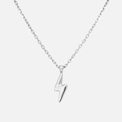 Silver lightning bolt necklace on a white background